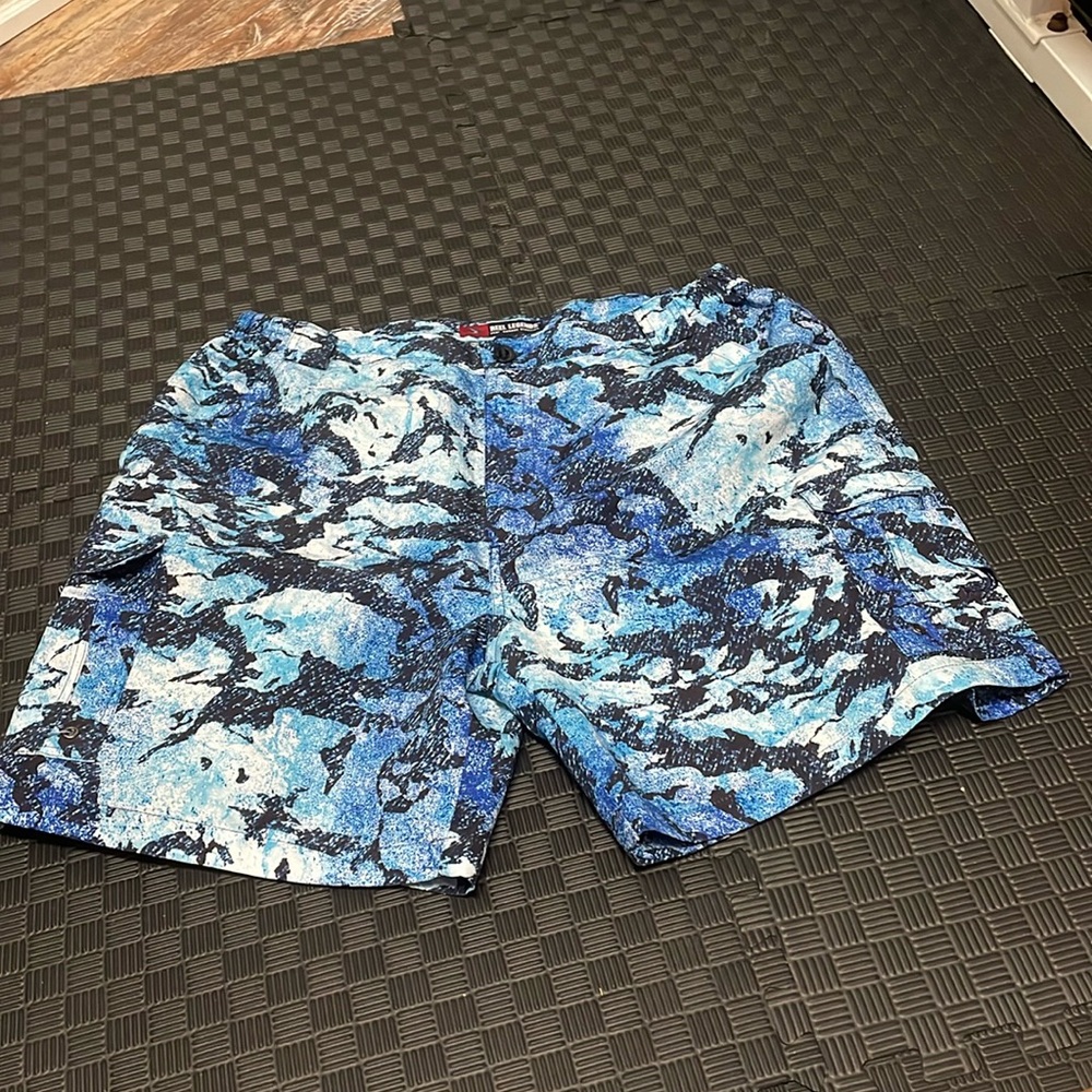 Reel Legends size XL shorts with blue water/glacier type pattern